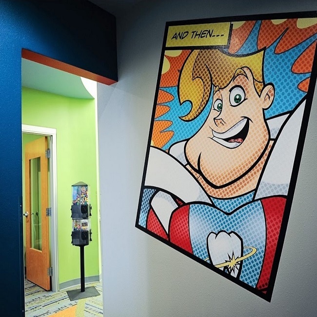 Comic themed walled murals and  other attractions at Smile Shoppe Pediatric