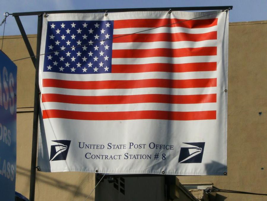 Mailing Service Center - flag at rear entrance