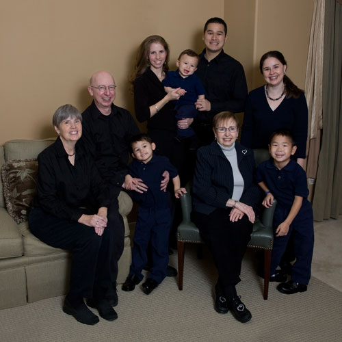 Extended Family Portrait In Home with Grandparents, Parents, Children &