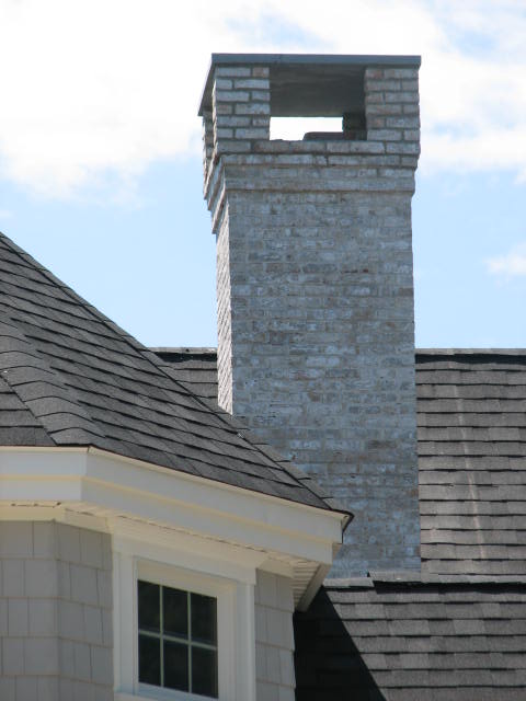 brick chimney with stone cap