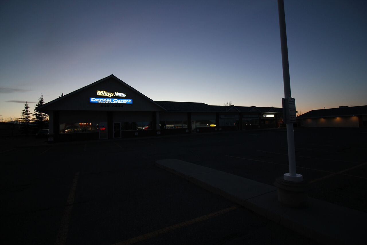 Twilight view of Village Lane Dental Centre Okotoks, AB T1S 1Z6