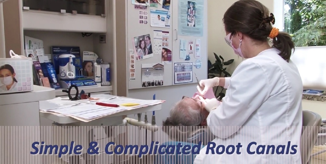 Dentist performing root canal at Portland endodontics center Powell Family 